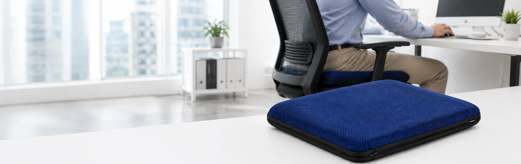 Blue AJ Air Cushion displayed in a modern office workspace with an ergonomic desk chair.